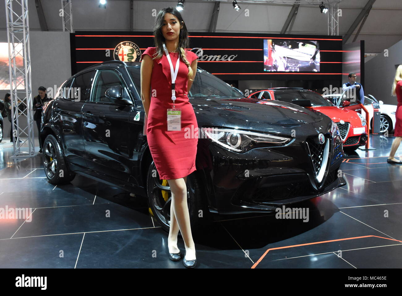 Casablanca, Morocco. 12th Apr, 2018. A model poses beside an Alfa Romeo