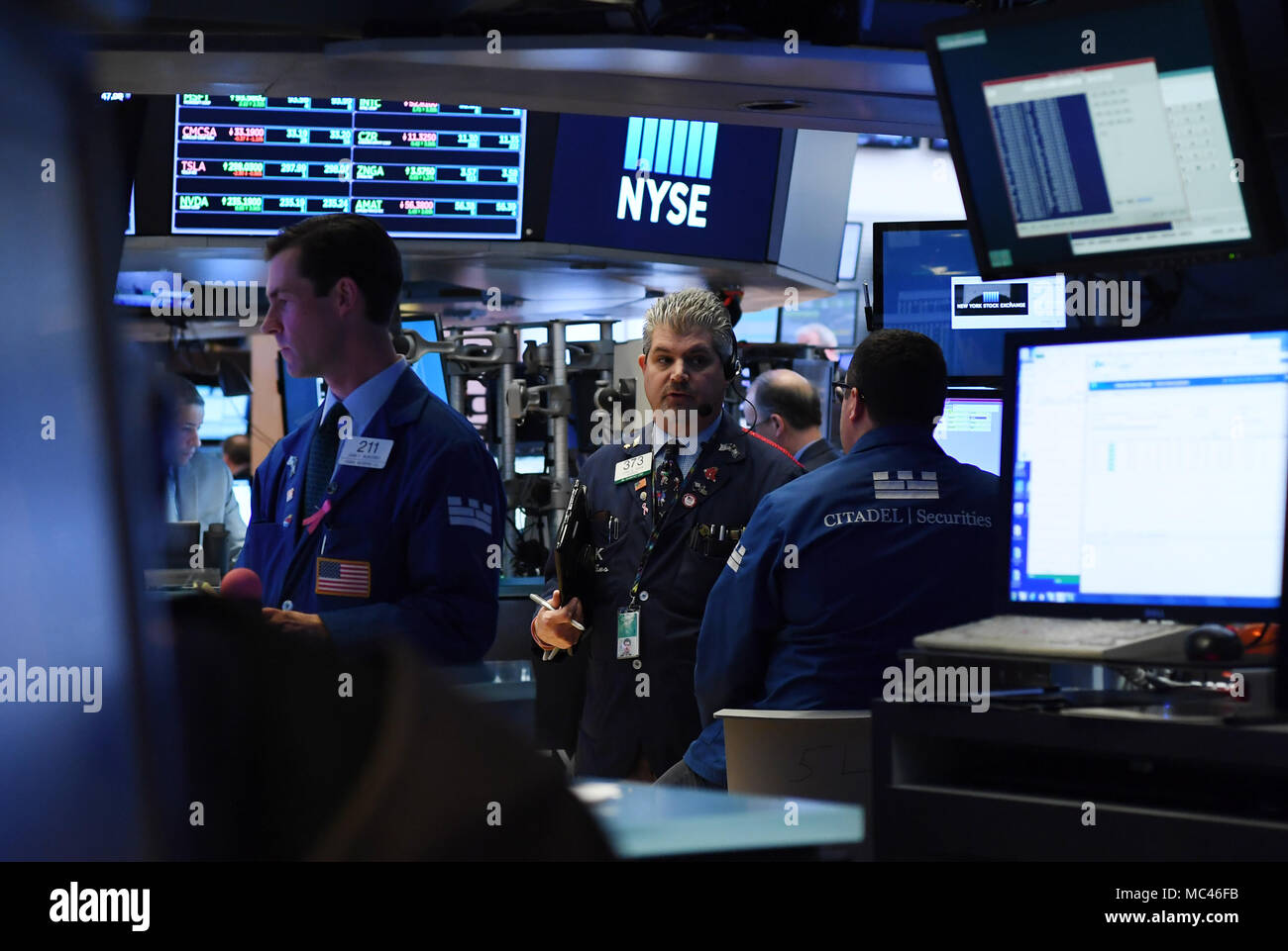 New York, USA. 12th Apr, 2018. Traders work at the New York Stock Exchange in New York, the United States, on April 12, 2018. U.S. stocks closed higher on Thursday. The Dow Jones Industrial Average gained 293.60 points, or 1.21 percent, to 24,483.05. The S&P 500 rose 21.80 points, or 0.83 percent, to 2,663.99. The Nasdaq Composite Index was up 71.22 points, or 1.01 percent, to 7,140.25. Credit: Li Rui/Xinhua/Alamy Live News Stock Photo