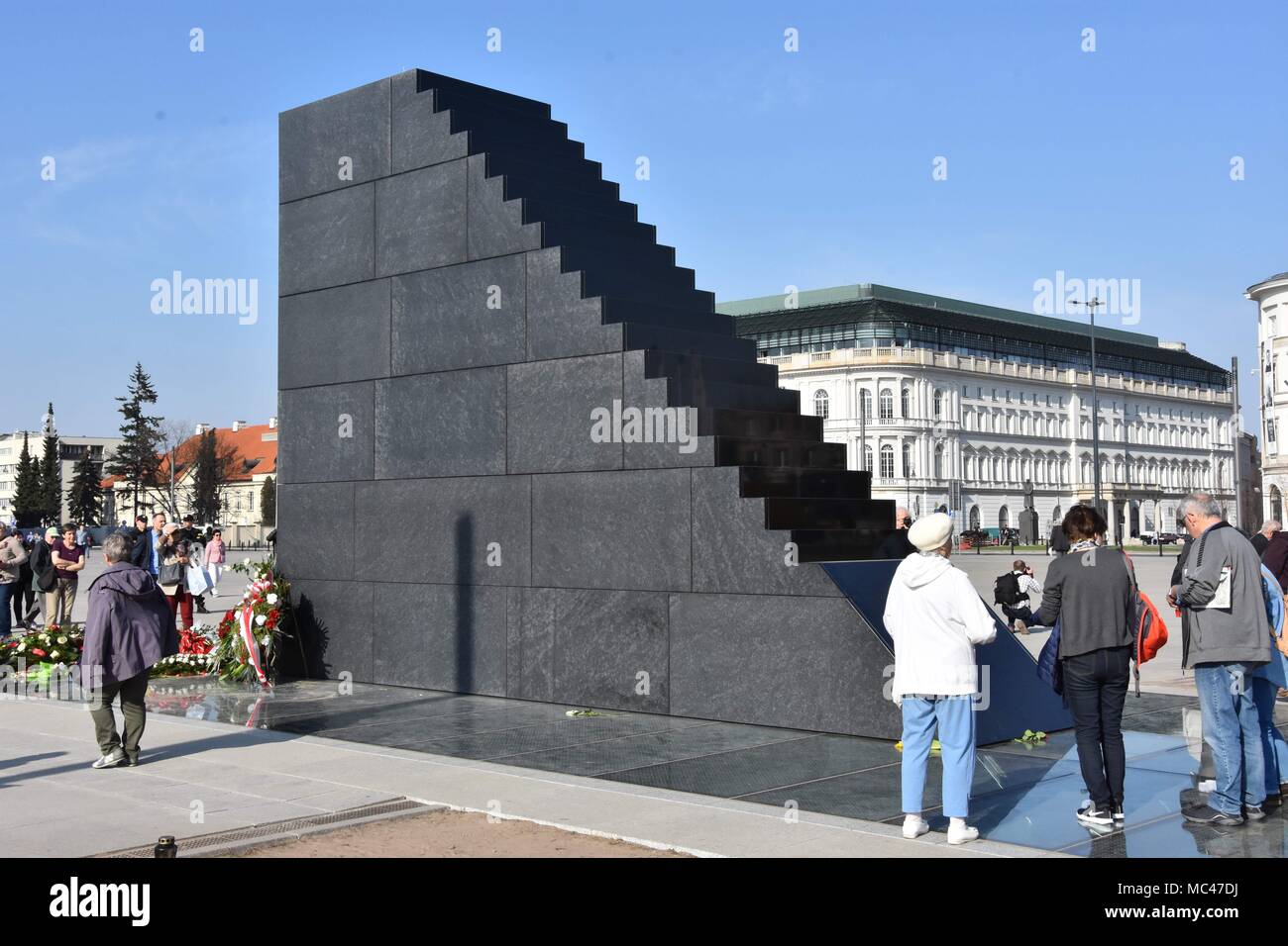 April 11, 2018 Warsaw Poland monument to the victims of the Smolensk plane crash. The monument was unveiled on the 8th anniversary of the tragic accident of the presidential airplane flying to the ceremony to Katyn. 12th Apr, 2018. In the kastrofie of the Polish plane on April 10, 2010, President Lech KaczyÃ±ski and 95 people died. Fearing the attempt to devastate the monument, the police are watching Credit: Credit: /ZUMA Wire/Alamy Live News Stock Photo