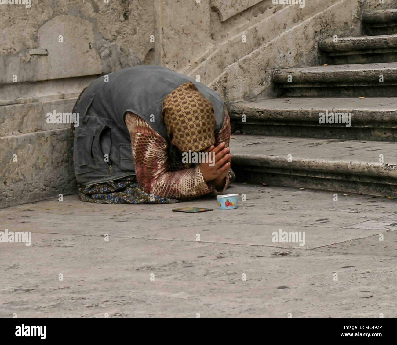 Rome, Italy. 14th Oct, 2004. On a street in Rome, an old woman begs for ...
