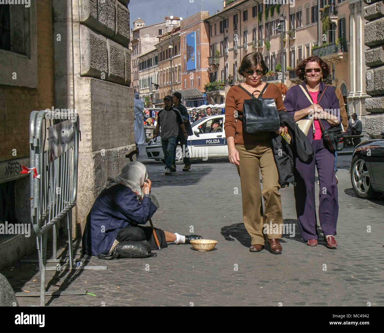 Woman begging on street corner hi-res stock photography and images - Alamy
