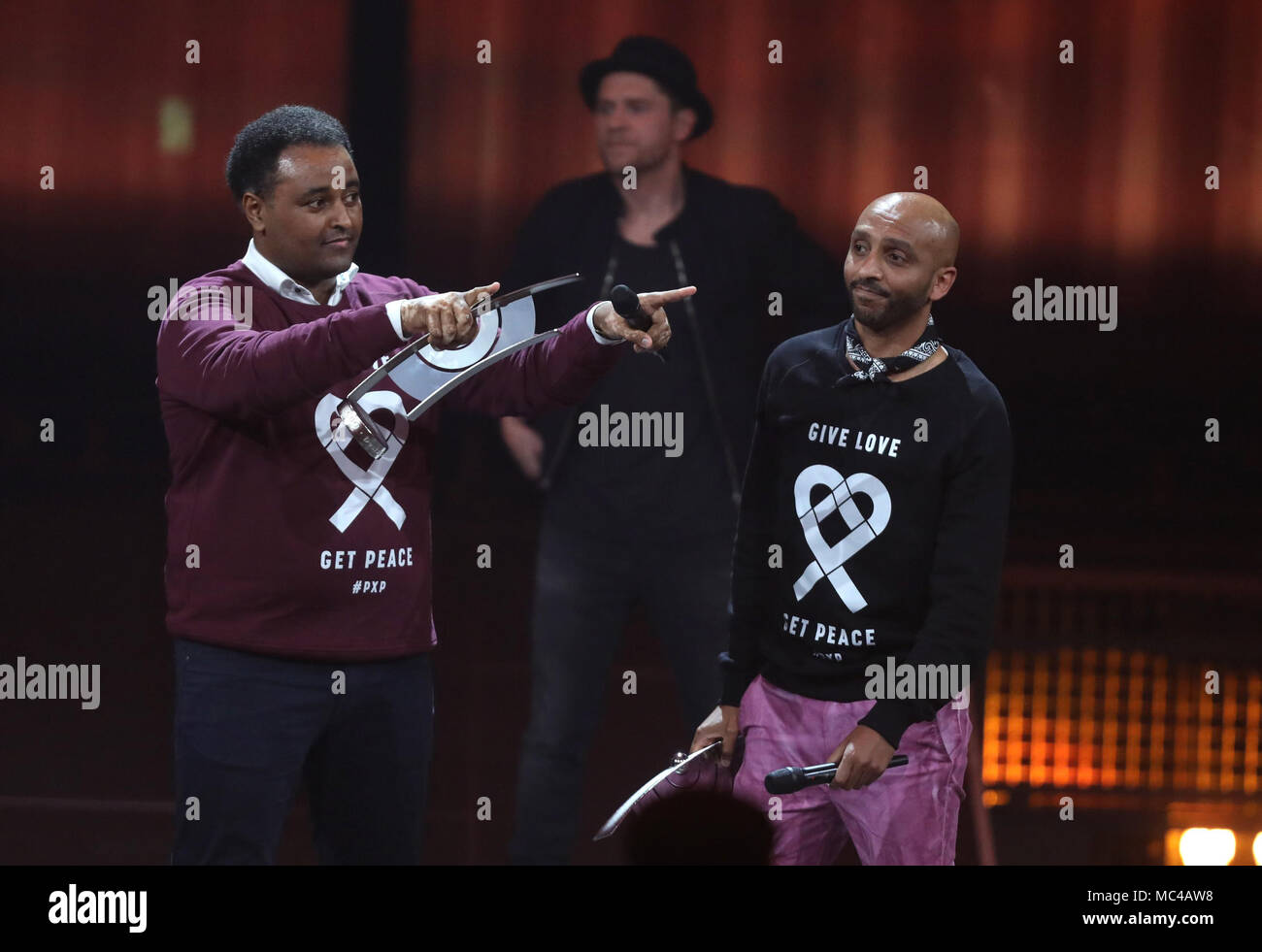 12 April 2018, Germany, Berlin: Fetsum Sebhat (L) and Tedros Tewelde receiving the Social Engagement Echo award at the 27th German music awards ceremony, Echo. Photo: Jörg Carstensen/dpa Stock Photo