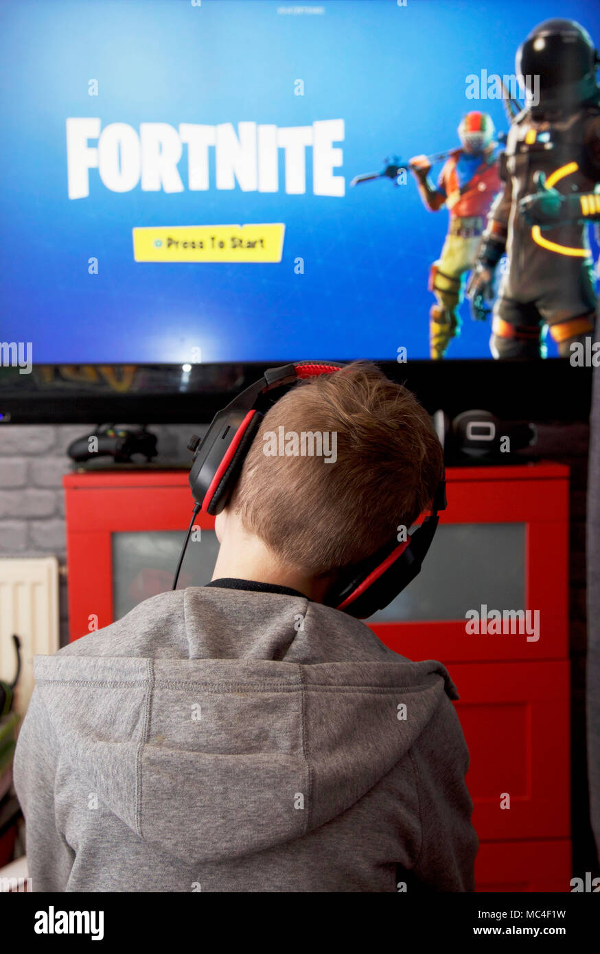 A boy plays Fortnite Battle Royale on his Xbox one Stock Photo - Alamy