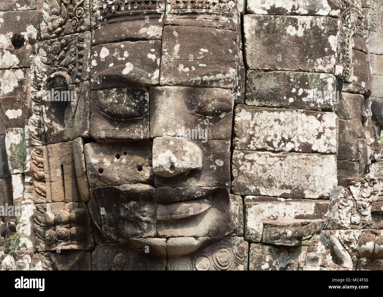 Close up of a carved Buddha face, Bayon temple, Angkor Thom, Angkor UNESCO World Heritage site, Cambodia Asia Stock Photo