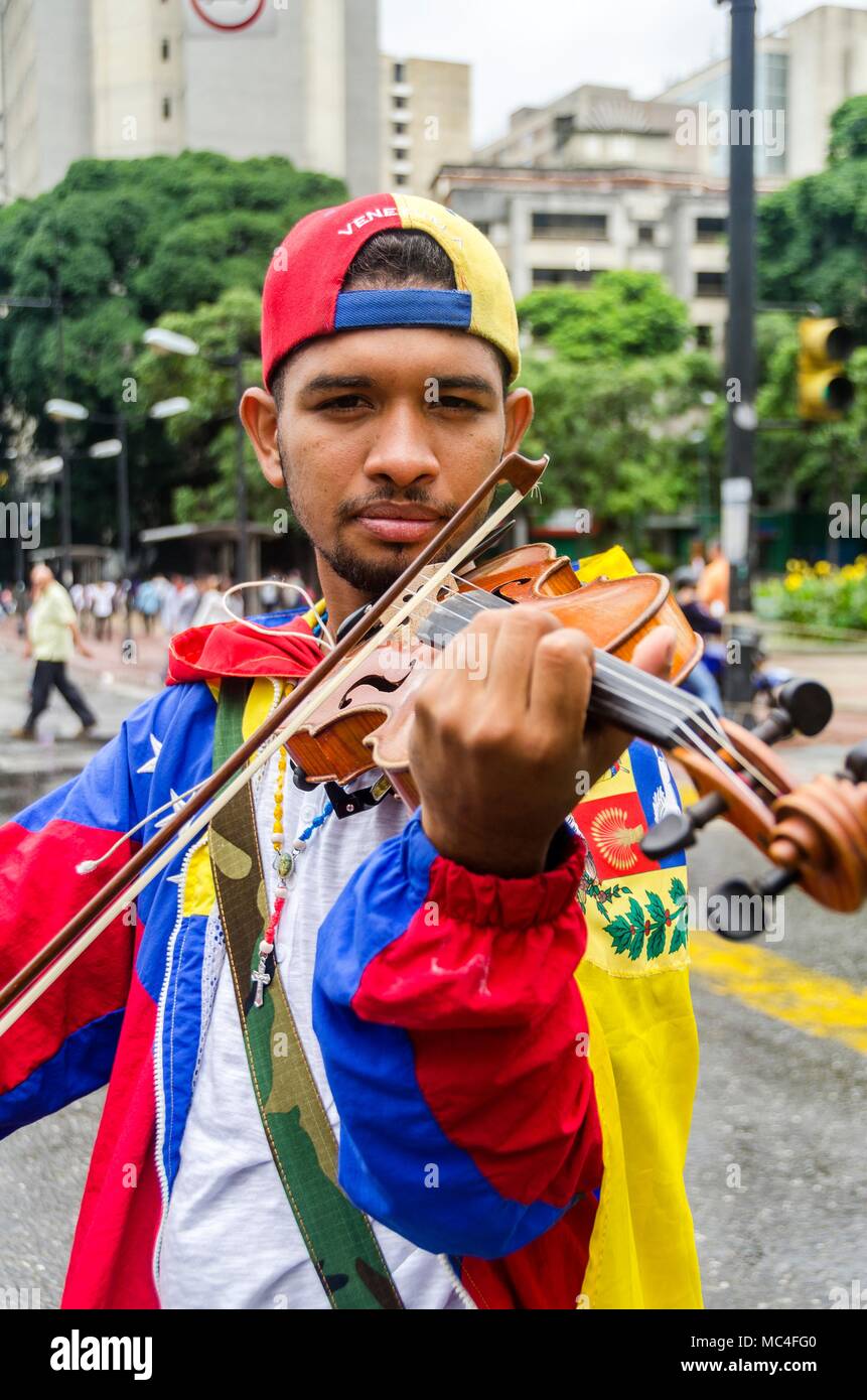 The musician Wuilly Arteaga is the 23 year old who, with his violin, has appeared in different manifestations of the opposition playing the national a Stock Photo