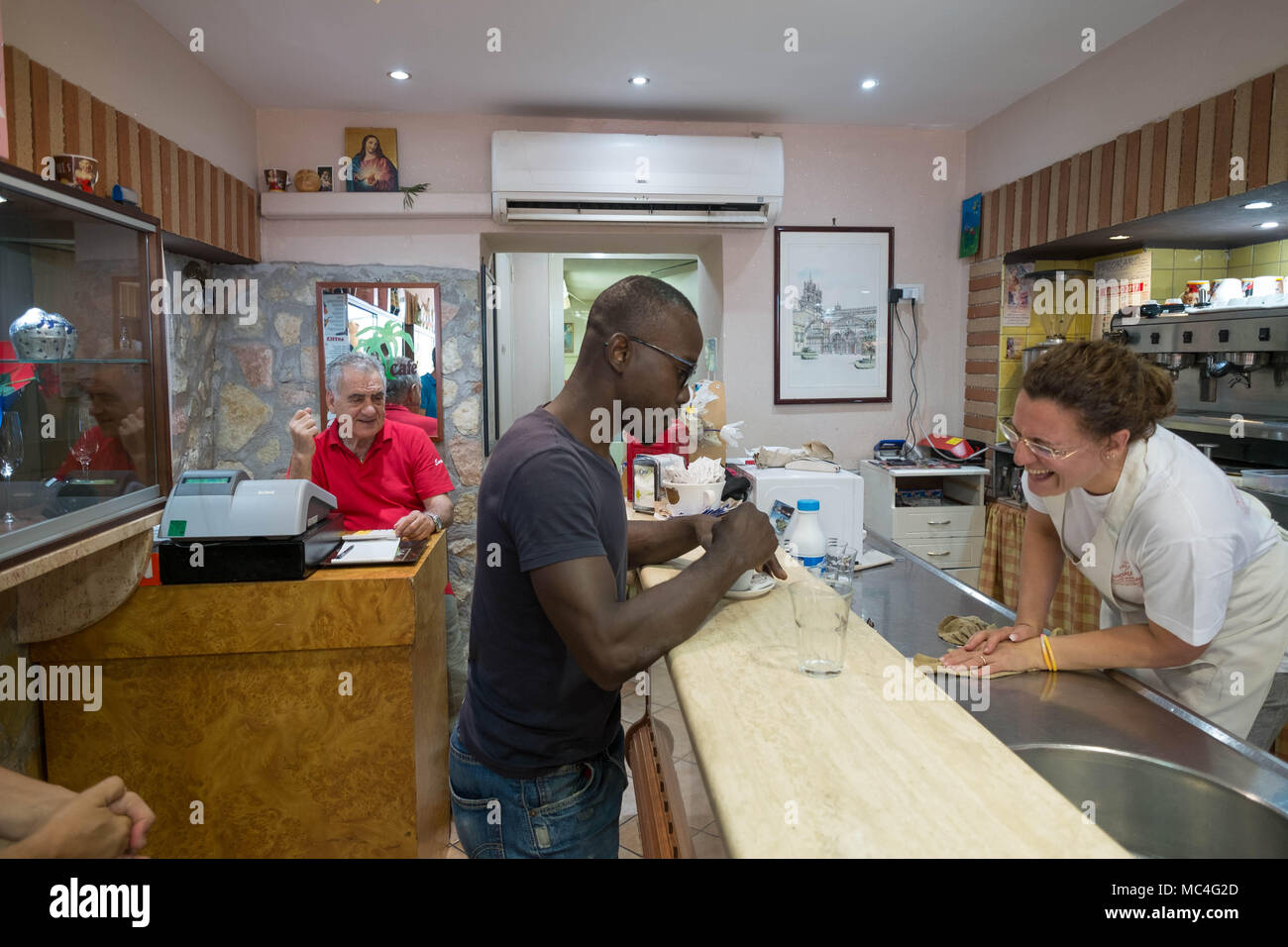 Ethnic integration in Palermo is a reality. In Ballarò's market bar Stock Photo