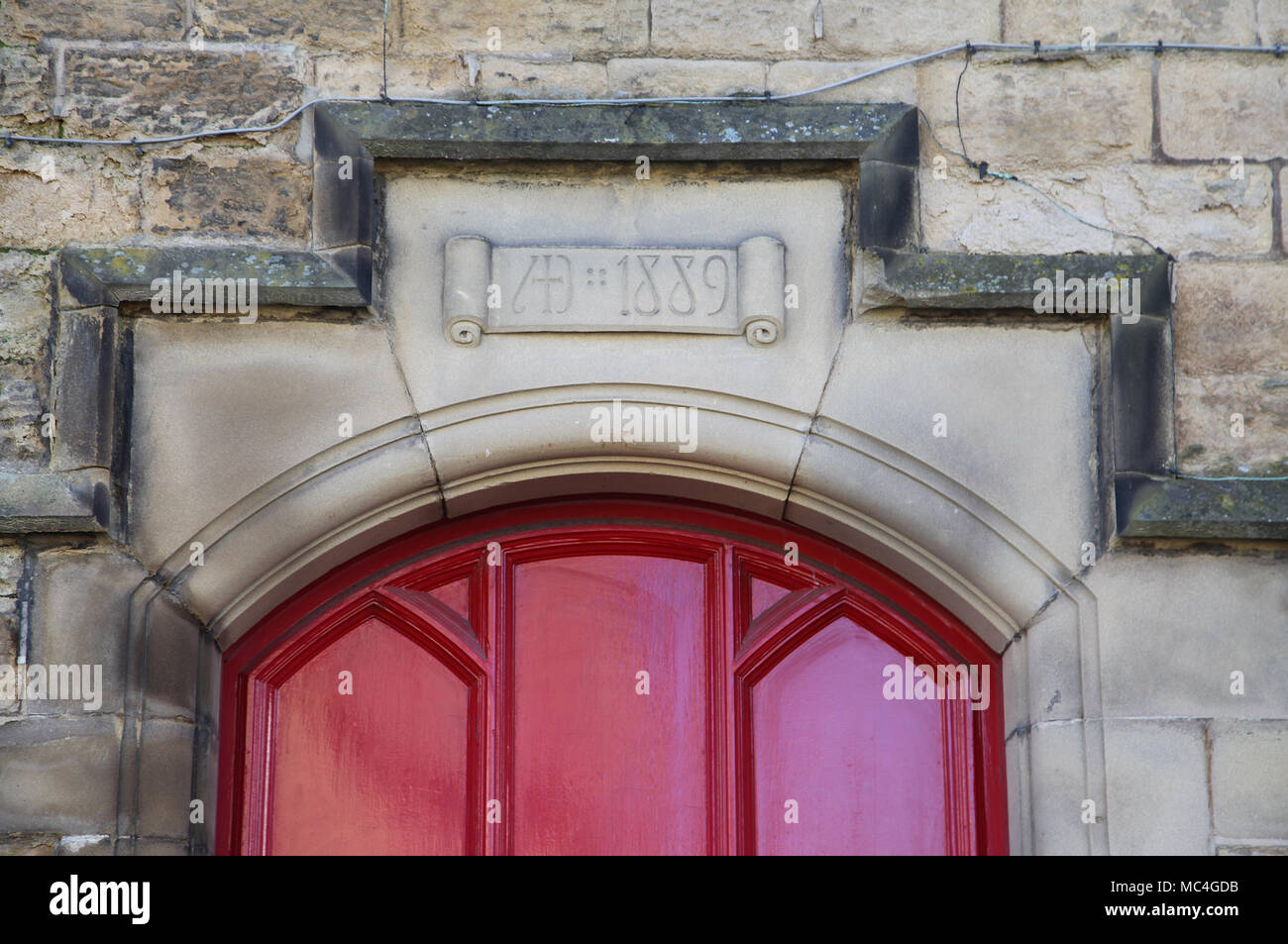 1889 date stone above a door in Bakewell Stock Photo