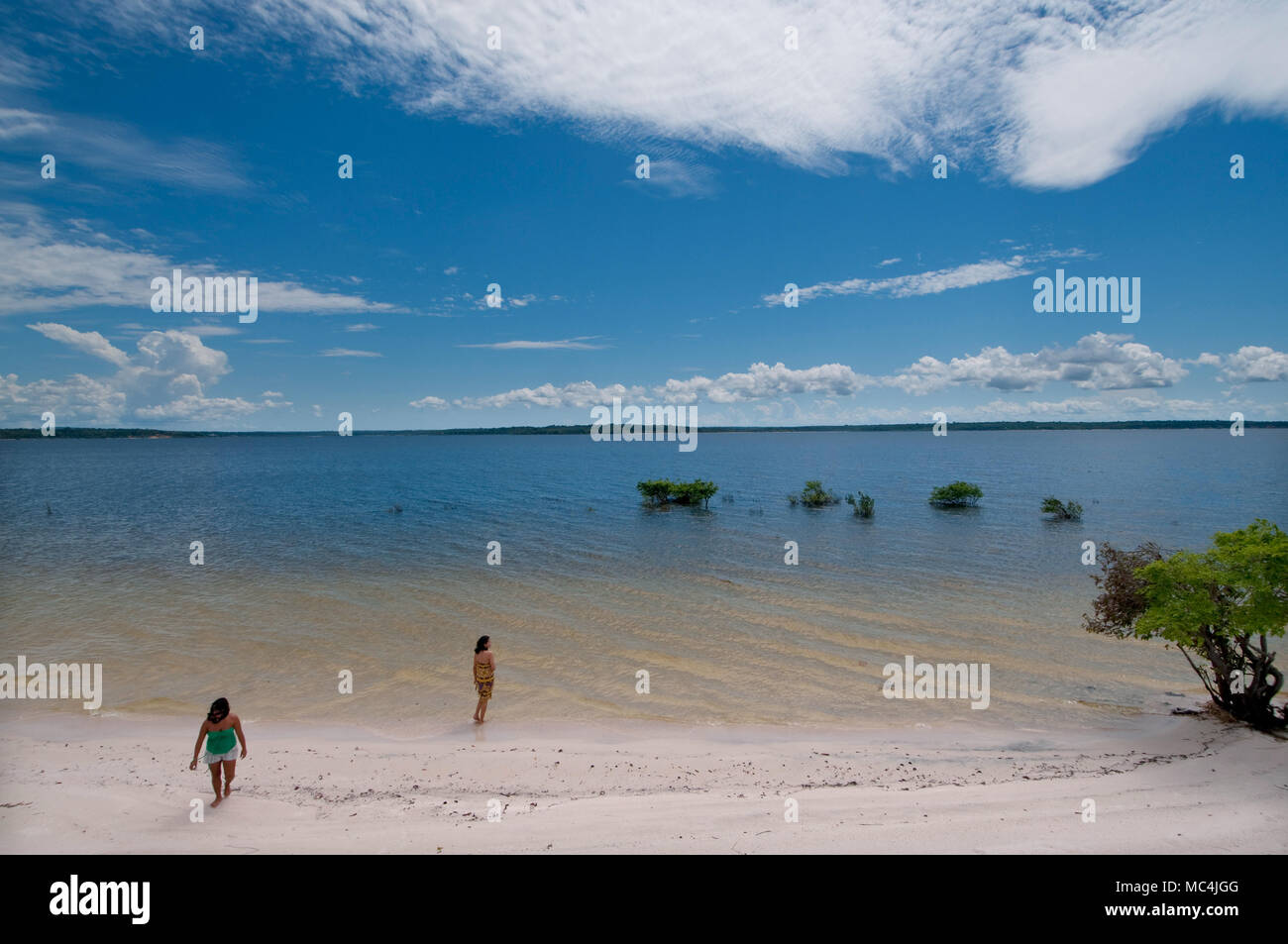 After a lot of time at work, the staff of Saude e Alegria have a  bath along a bank of Tapajos river Stock Photo