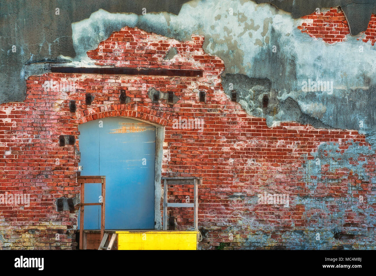 Loading dock on the backside of an old brick faced building Stock Photo