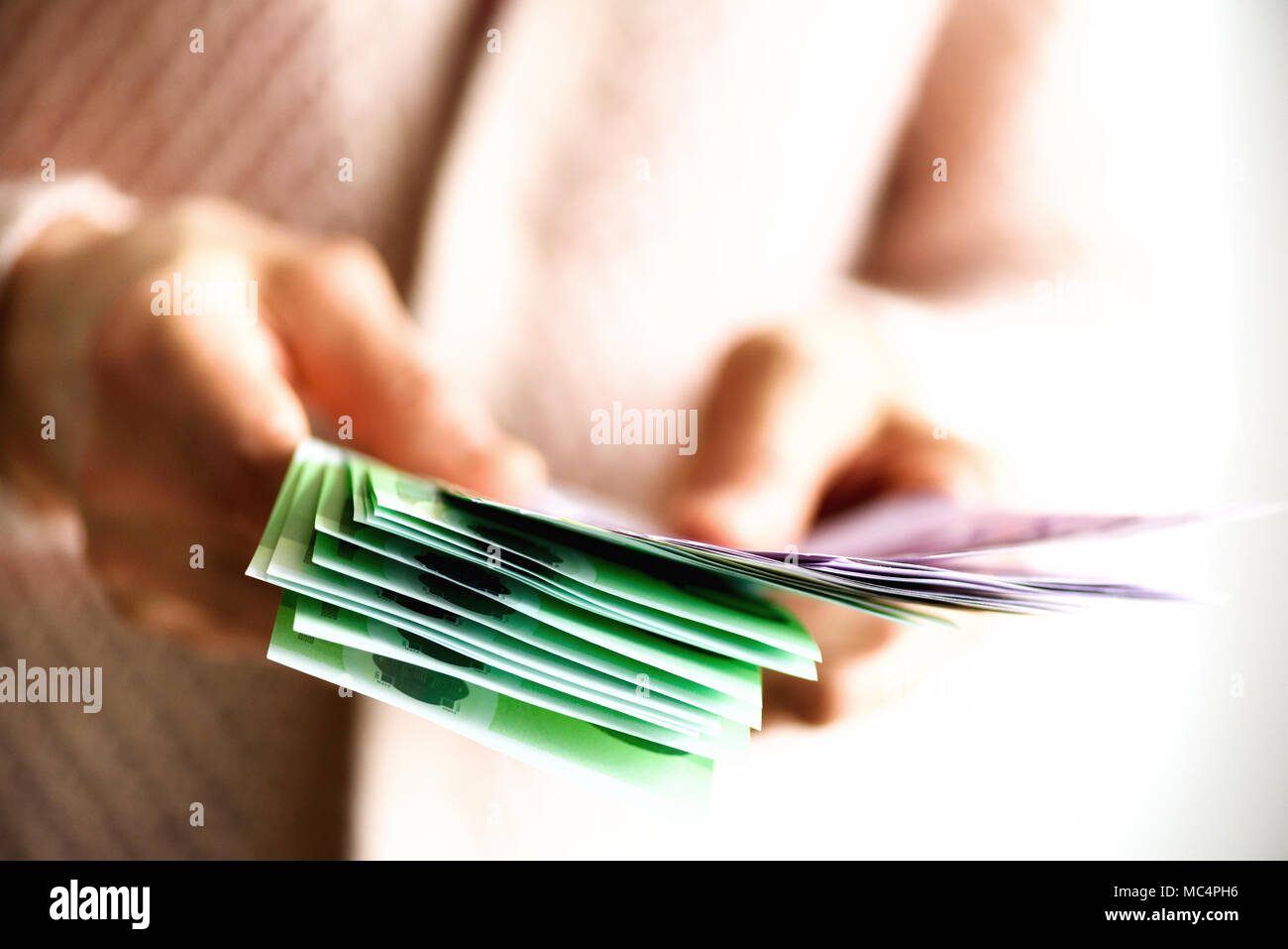 Woman hands holding euro currency money banknotes. Payment and cash concept. Copy space Stock Photo