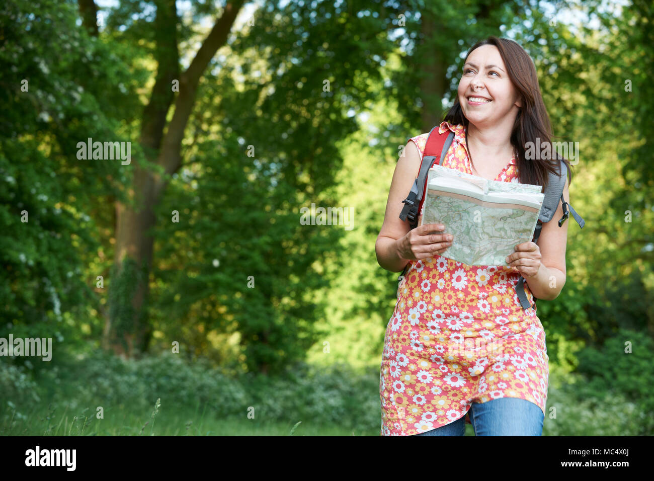 Mature Woman Enjoying Hike In Countryside Stock Photo
