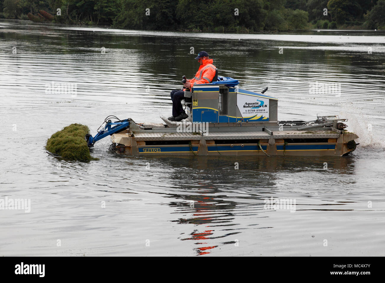 A 3 Truxor amphibious machine for collecting and gathering aquatic weeds in operation at Trentham Gardens, Stoke on Trent Stock Photo