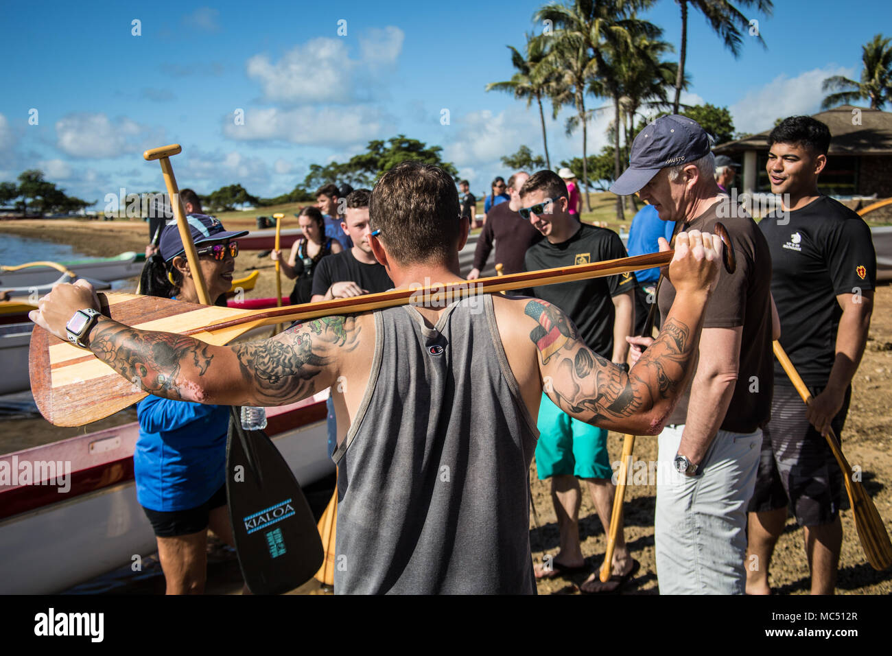 Coach and steersman of the Ka Mamala Hoe Canoe Club addresses her boat