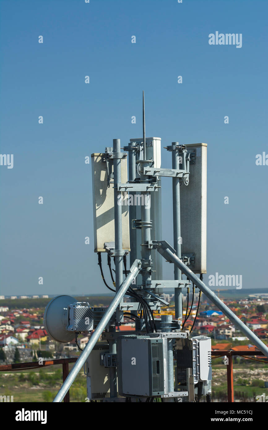 4G antenna an the roof, blue sky background, network communications,  internet GSM, mobile phone Stock Photo - Alamy