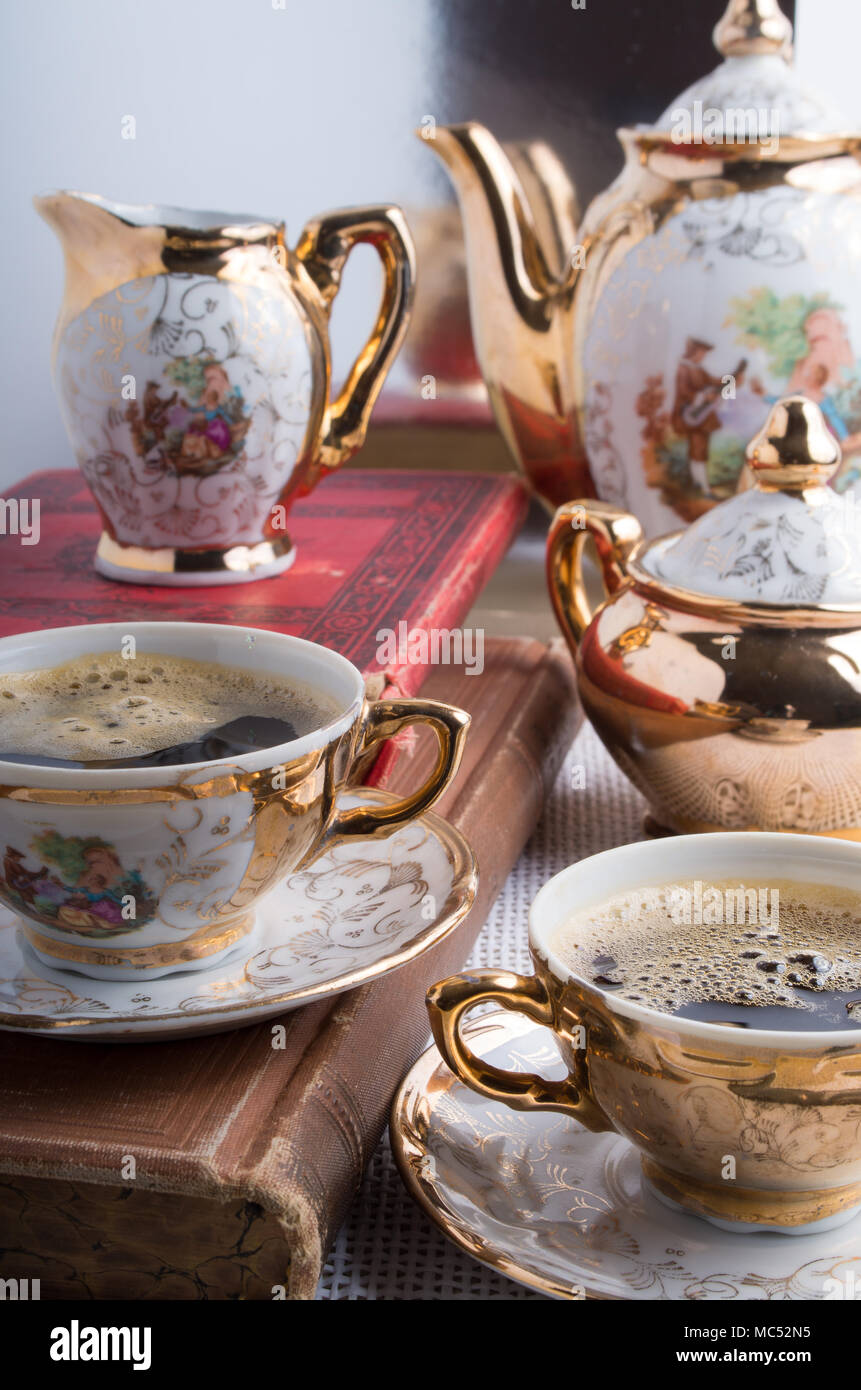 Antique porcelain coffee cups with hot espresso and tableware from the 19th  century German Bavaria Stock Photo - Alamy
