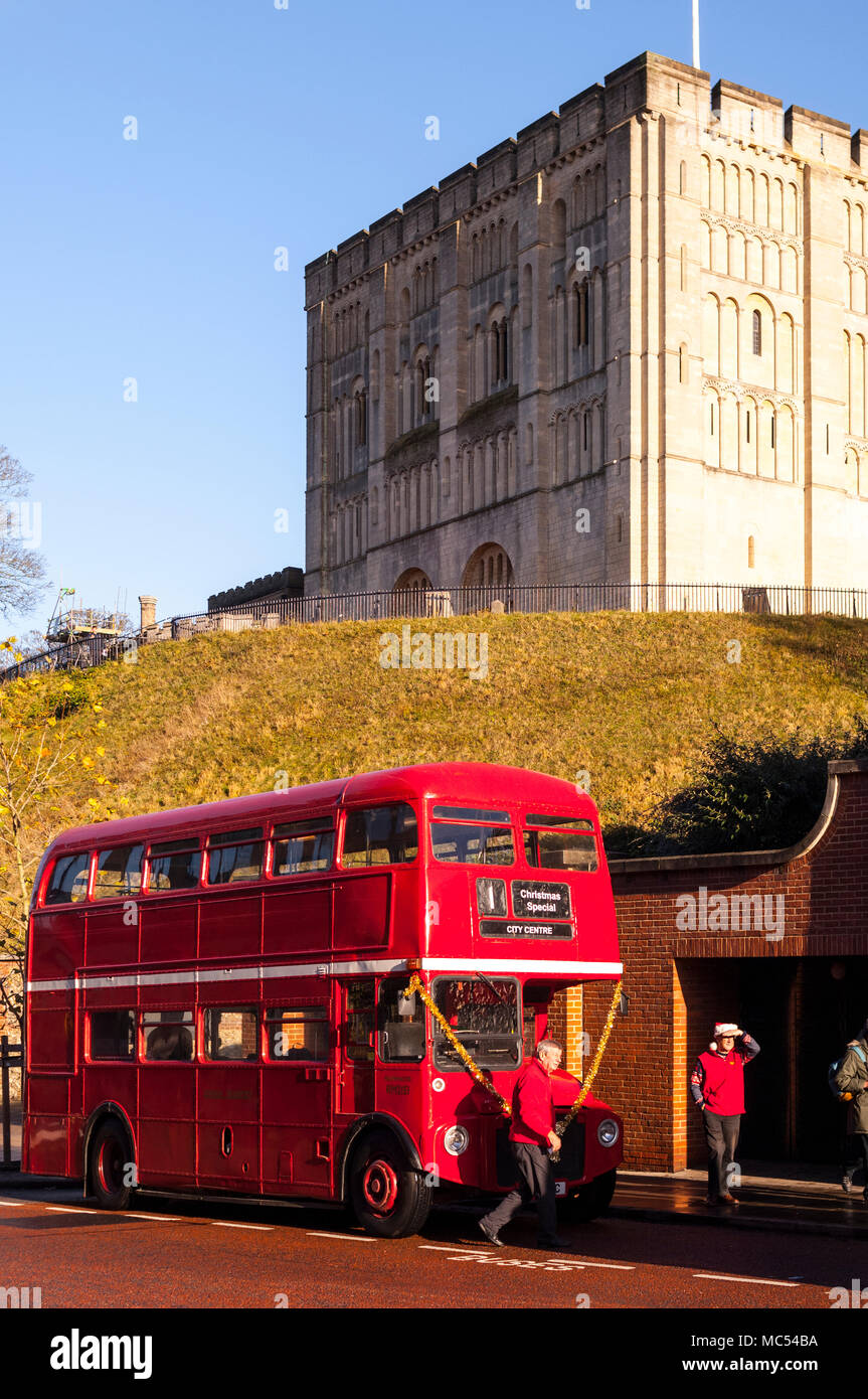 A vintage Double Decker bus parked in front of the castle in Norwich , Norfolk , England , Uk Stock Photo