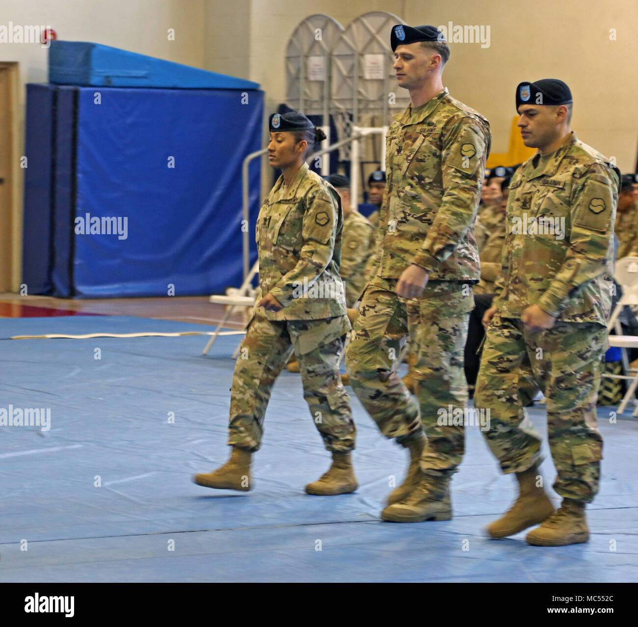 1st Sgt. Johanna Y. Castro (Left), the outgoing senior enlisted leader of  Headquarters and Headquarters Company, 19th Expeditionary Sustainment  Command, and a native of San Pedro de Macoris, Dominican Republic, marches  alongside