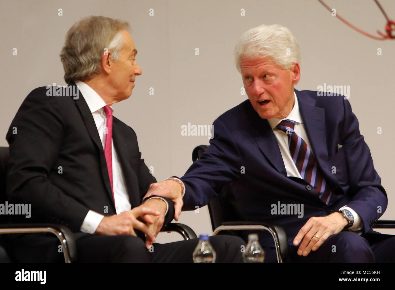 Former British Prime Minister Tony Blair and former US President Bill Clinton  at  Queen's University Belfast, Tuesday, April 10th, 2018. Tuesday marks 20 years since politicians from Northern Ireland and the British and Irish governments agreed what became known as the Good Friday Agreement. It was the culmination of a peace process which sought to end 30 years of the Troubles. Two decades on, the Northern Ireland Assembly is suspended in a bitter atmosphere between the two main parties. Stock Photo