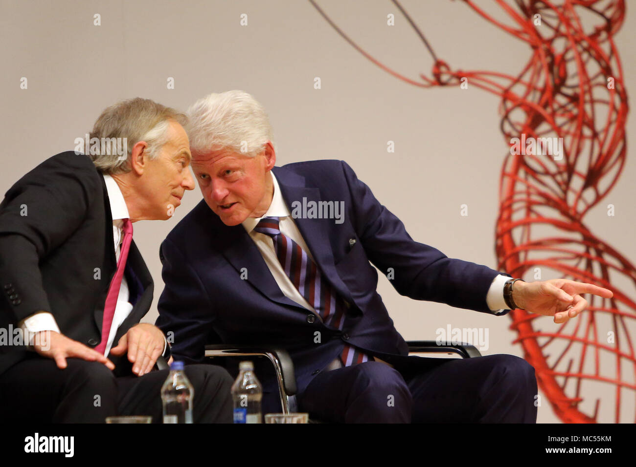 Former British Prime Minister Tony Blair and former US President Bill Clinton   at  Queen's University Belfast, Tuesday, April 10th, 2018. Tuesday marks 20 years since politicians from Northern Ireland and the British and Irish governments agreed what became known as the Good Friday Agreement. It was the culmination of a peace process which sought to end 30 years of the Troubles. Two decades on, the Northern Ireland Assembly is suspended in a bitter atmosphere between the two main parties. Stock Photo