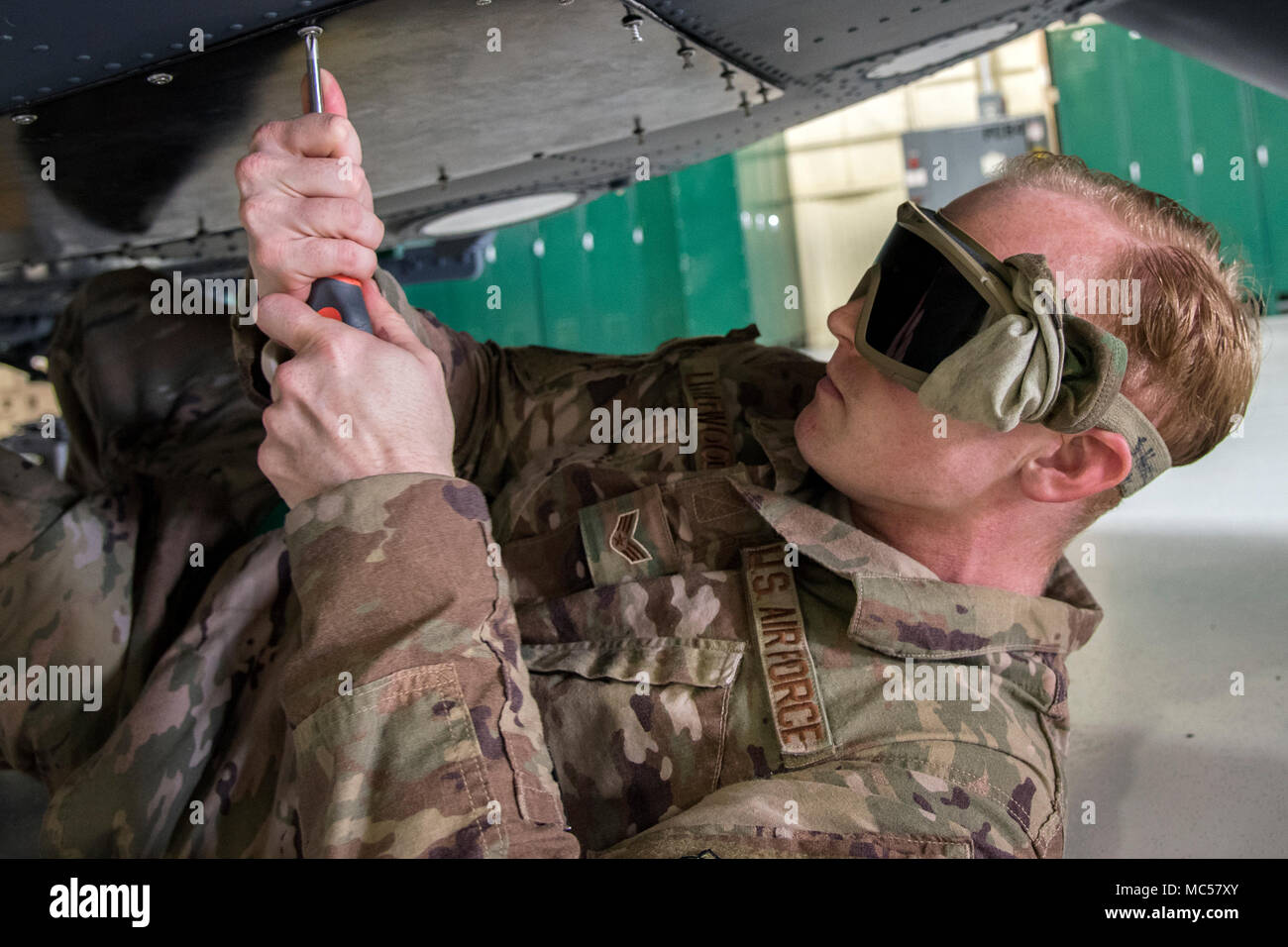 Senior Airman Justin Littlewood, 723d Aircraft Maintenance Squadron (AMXS) avionics technician, bolts a quad bay onto the bottom of an HH-60G Pave Hawk, Jan. 22, 2018, at Moody Air Force Base, Ga. From 16-25 Jan., Airmen from the 723d AMXS performed 216 hours of maintenance on an HH-60 after it returned to Moody following 350 days of depot maintenance at Naval Air Station (NAS) Jacksonville. While at NAS Jacksonville, the HH-60 underwent a complete structural overhaul where it received new internal and external components along with repairs and updated programming. (U.S. Air Force photo by Air Stock Photo