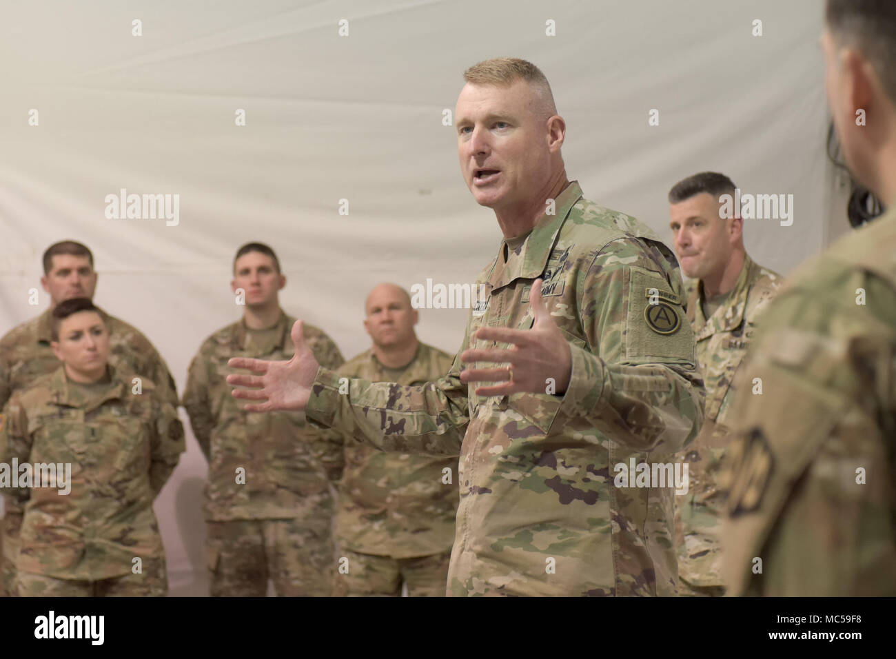 Maj. Gen. Terrence McKenrick, U.S. Army Central deputy commanding general, talks to Soldiers of the Massachusetts Army National Guard's 151st Regional Support Group Jan. 30, 2018, at Fort Hood, Texas, where they are participating in a culminating training exercise with First Army for the Pennsylvania Army National Guard's 28th Infantry Division. Both units are preparing to deploy to the Middle East, where the 151st RSG Soldiers will augment the ARCENT staff, and the 28th ID Soldiers will support theater combat operations, Operation Spartan Shield, and theater security cooperation with the Unit Stock Photo