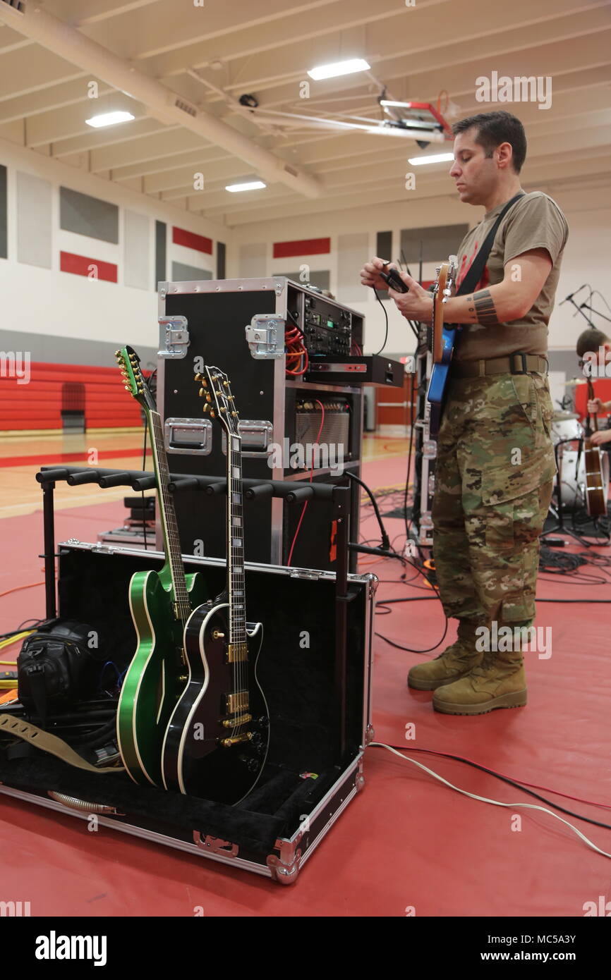 SFC Roger Kirchner preps for Fire For Effect's performance at Mexico Junior High School January
