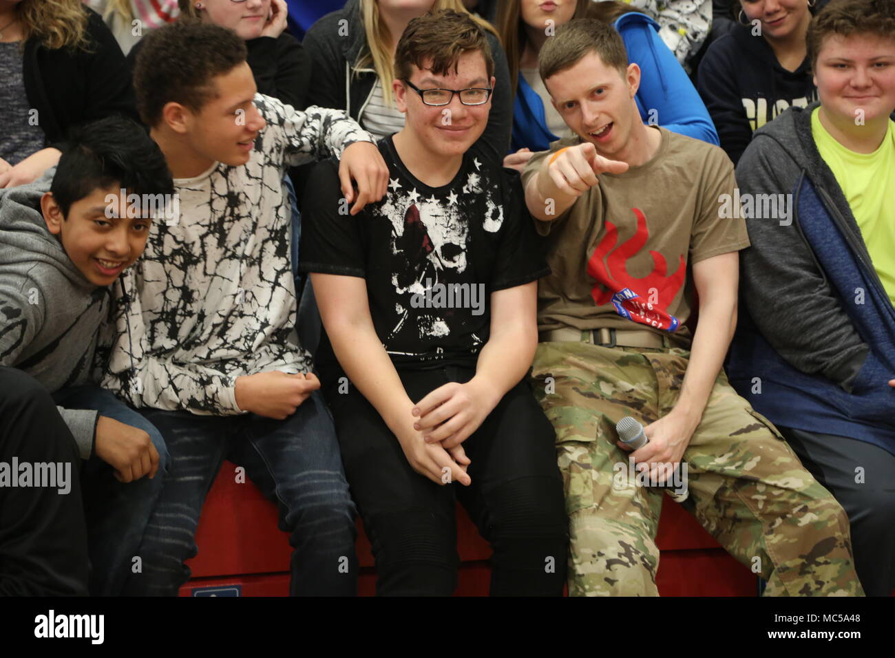 SPC Zach Nickerson engages with the students at Mexico Junior High