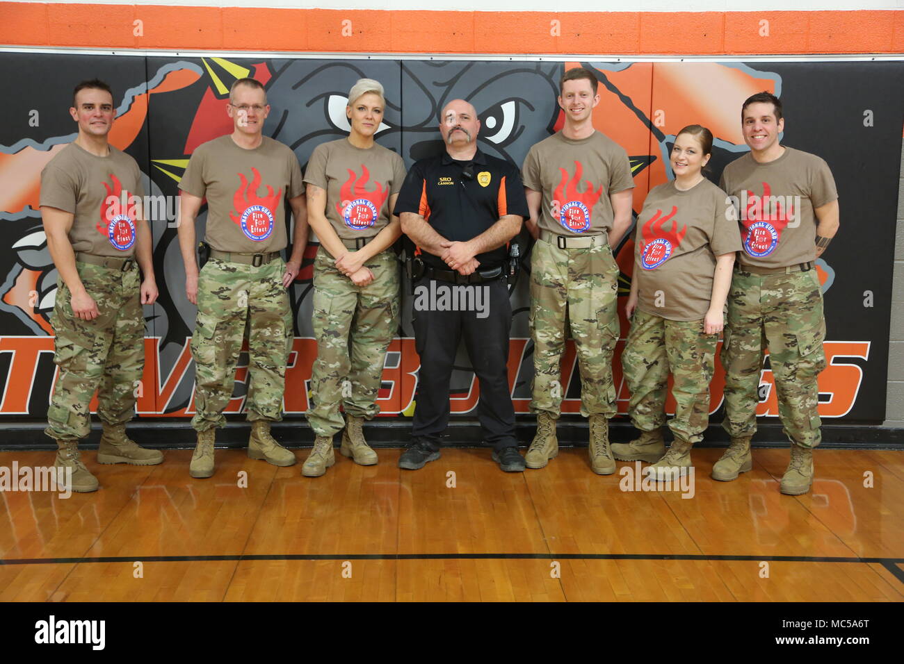 Fire For Effect band members pose with Stover school resource officer