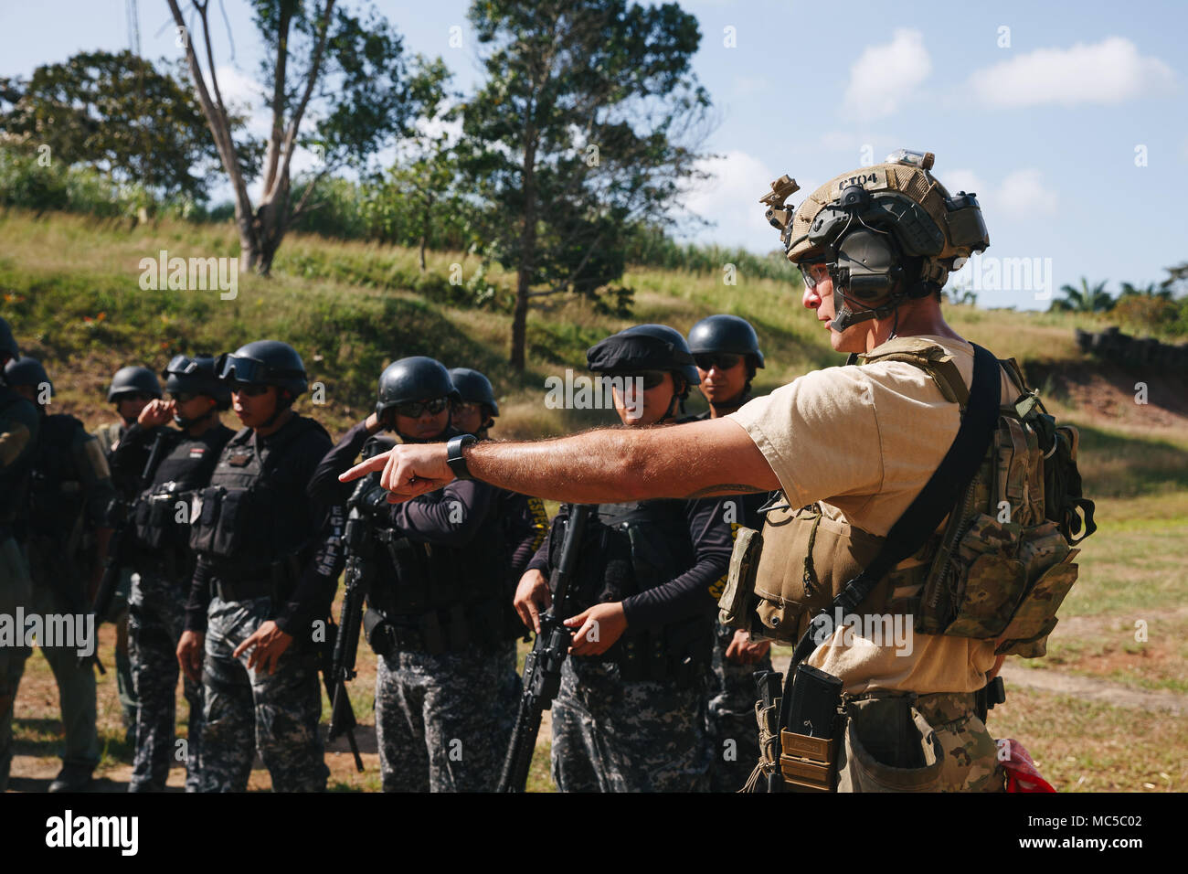 A U.S. Army Special Forces Soldier explains range procedures to Panamanian  counterterrorism security forces Jan. 30, 2018, during joint combined  marksmanship training in Panama City, Panama. Marksmanship training is  necessary before combined