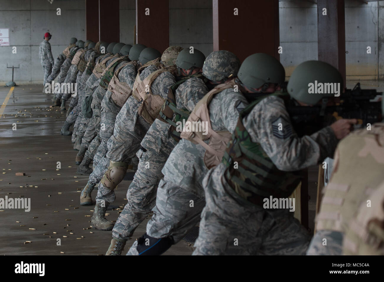 U.S. Air Force Airmen fire M-4 Carbines at targets during training at the combat arms training and maintenance range at Joint Base Langley-Eustis, Va., Jan. 23, 2018. While at CATM, military and civilian personnel learn how to fire a weapon, as well as learn the internals of their weapons and how to clean them properly. (U.S. Air Force photo by Airman 1st Class Tristan Biese) Stock Photo