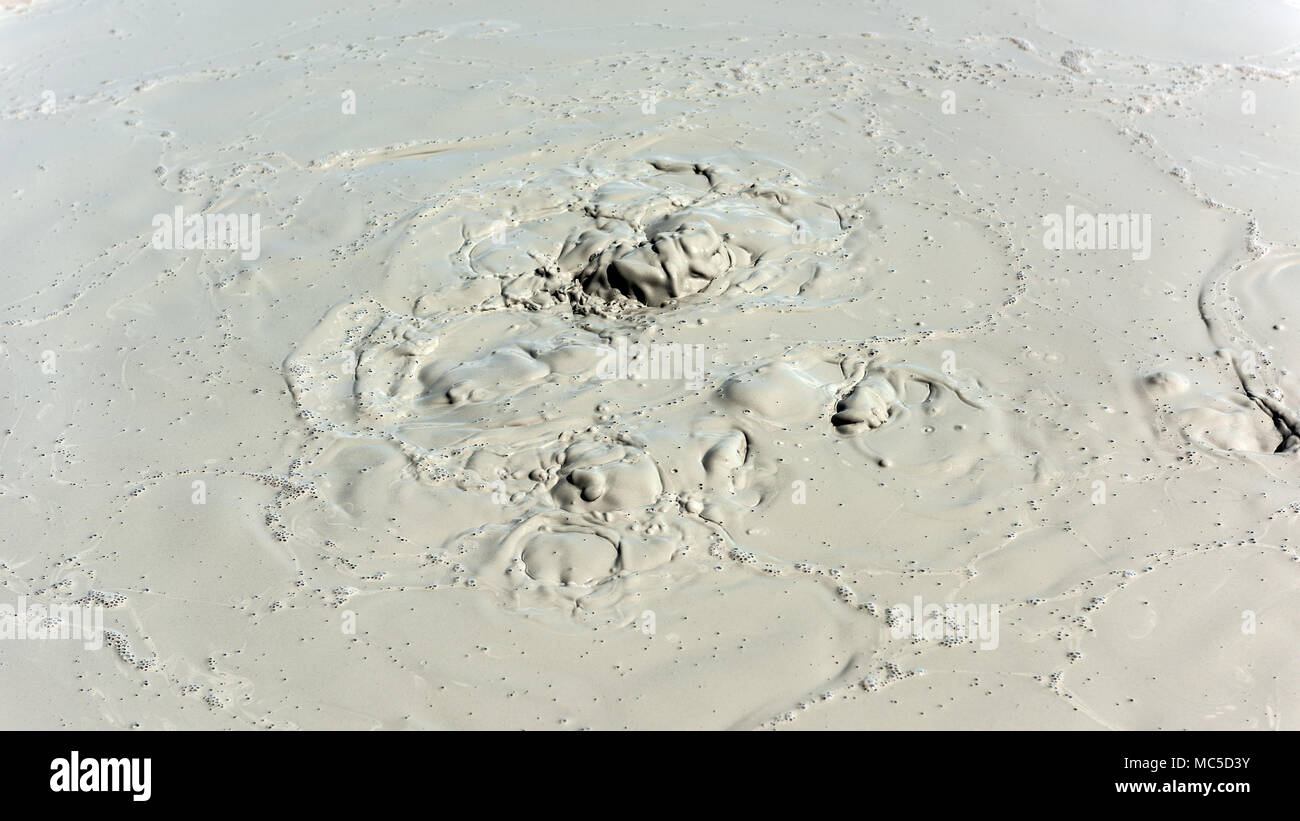 Boiling crater of mud volcano Stock Photo