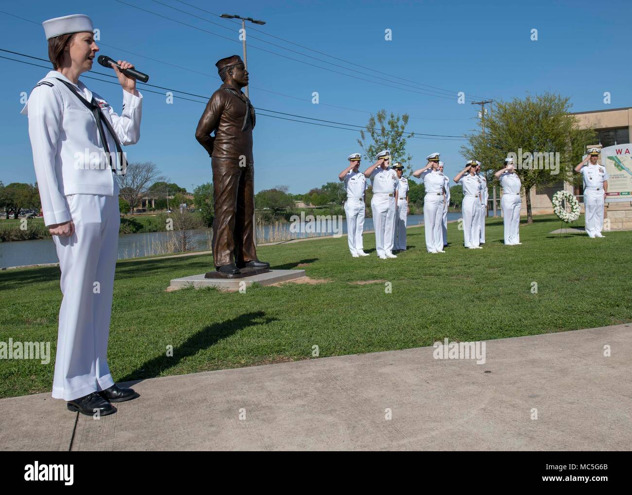 180404-N-YR245-0023 WACO, Texas (April 4, 2018) Sailors honor Doris “Dorie” Miller at a ceremony on the Waco Riverwalk during Waco Navy Week. The Navy Office of Community Outreach uses the Navy Week program to bring Navy Sailors, equipment and displays to approximately 15 American cities each year for a week-long schedule of outreach engagements. (U.S Navy photo by Mass Communication Specialist 2nd Class Craig Z. Rodarte/Released) Stock Photo