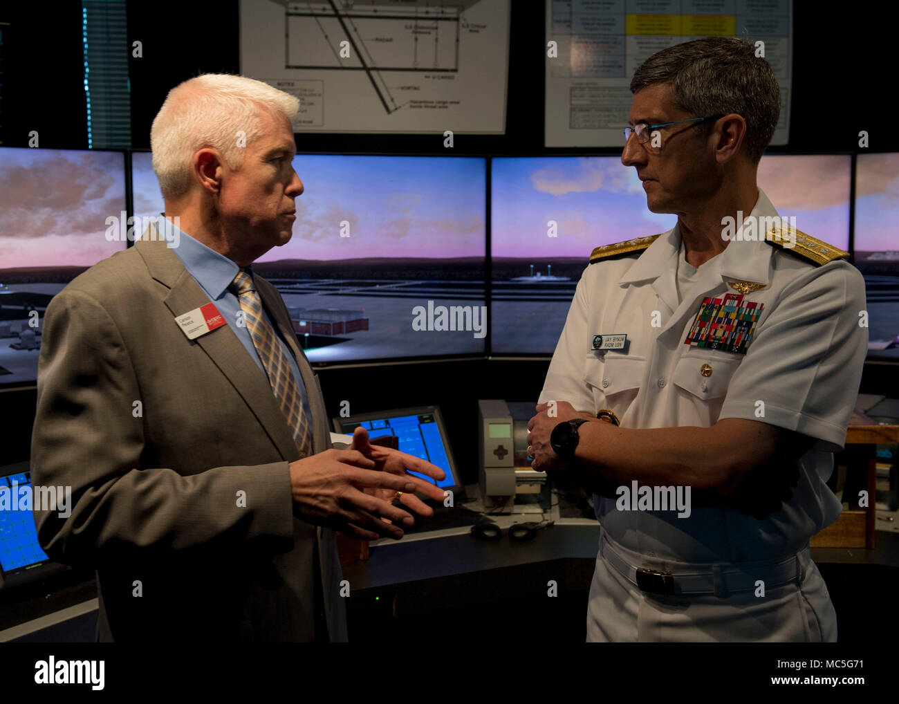 180403-N-YR245-0134 WACO, Texas (April 3, 2018) Rear Adm. Jay Bynum, chief of Naval Air Training, speaks with Carson Pearce, Aerospace Division director at Texas State Technical College, during Waco Navy Week. The Navy Office of Community Outreach uses Navy Week programs to bring Sailors, equipment and displays to approximately 15 American cities each year for a week-long schedule of outreach engagements. (U.S Navy photo by Mass Communication Specialist 2nd Class Craig Z. Rodarte/Released) Stock Photo