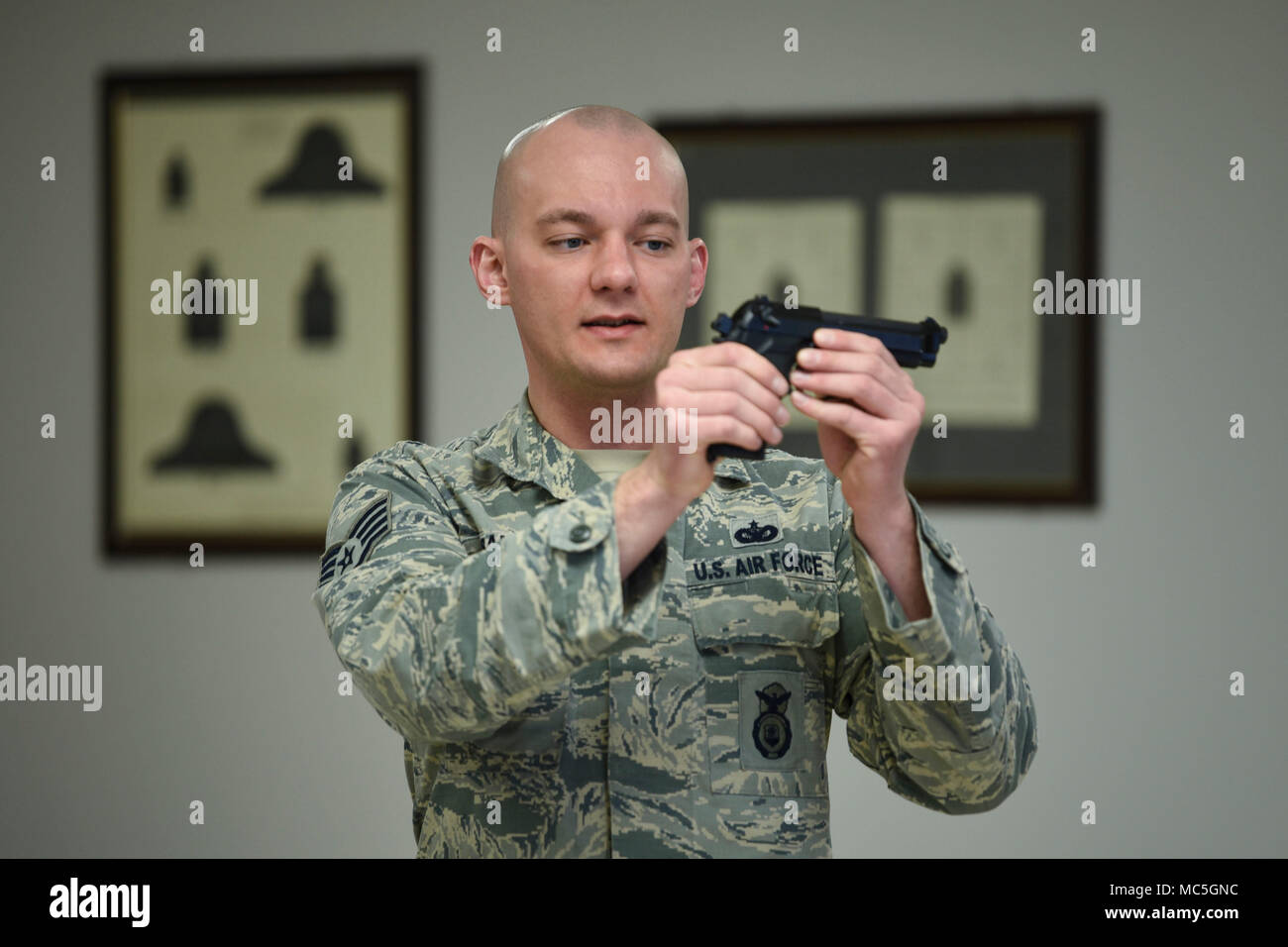 Air Force Staff Sgt. Damon Salyer, a 319th Security Forces Squadron firearms instructor, teaches