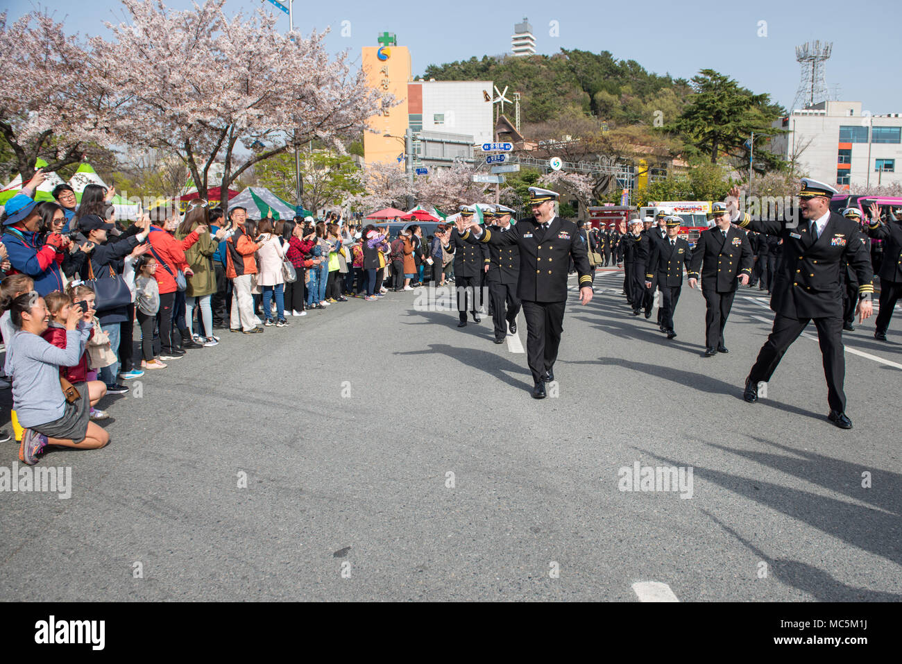 180406-N-TB148-392 CHINHAE, Republic of Korea (April 06, 2018) Sailors assigned to Commander, Fleet Activities Chinhae (CFAC), and Commander, U.S. Naval Forces Korea (CNFK) participate in the Jinhae Military Parade Festival also known as the Jinhae Cherry Blossom Festival in Changwon. Commemorating famed ROK naval hero Admiral Yi Sun-shin the ten-day festival coincides with the annual cherry blossom bloom which attracts over 2 million visitors. (U.S. Navy photo by Mass Communication Specialist Seaman William Carlisle) Stock Photo