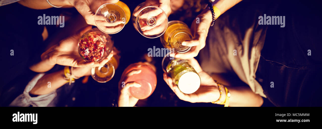 Directly below shot of friends holding drinks Stock Photo