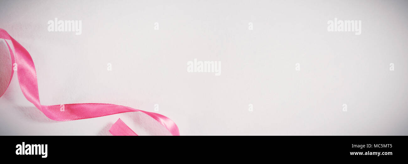 Pink ribbon on white background Stock Photo - Alamy