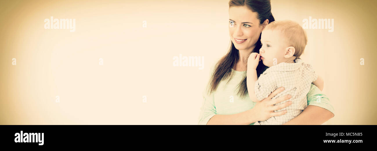 Happy mother carrying baby boy Stock Photo Alamy