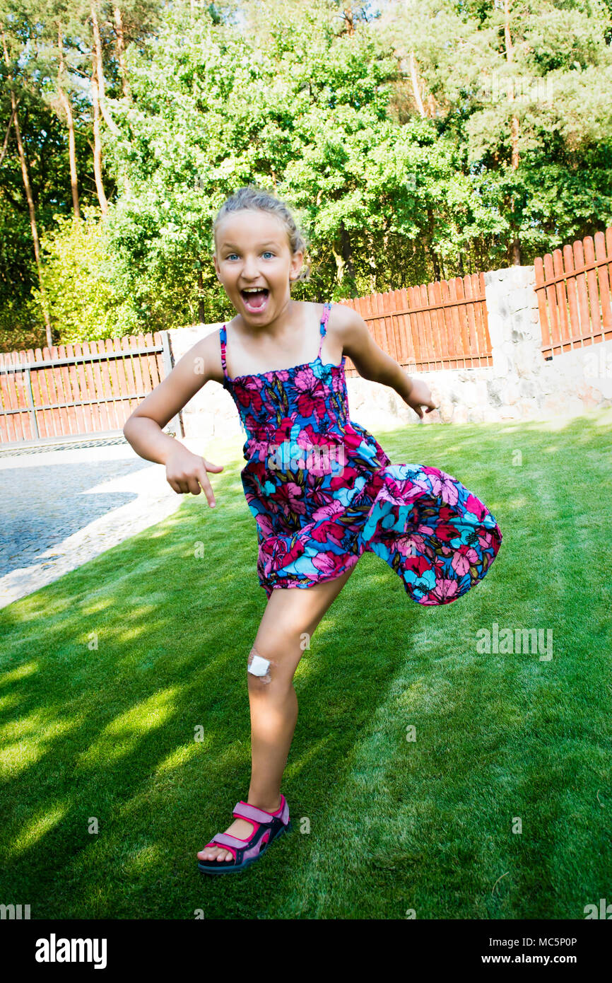Young girl having fun while racing Stock Photo - Alamy