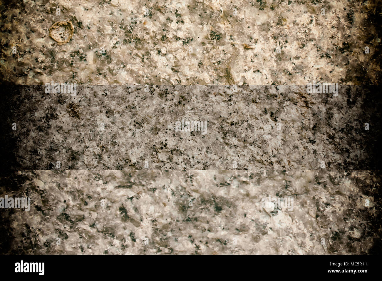 Granite rock closeup background, stone texture, cracked surface Stock Photo