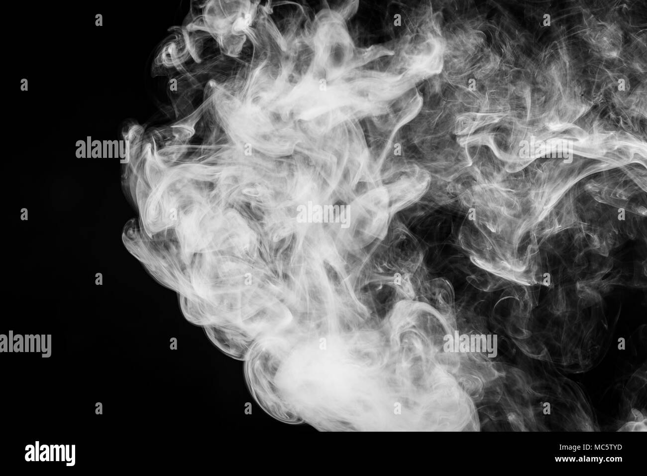 White cloud smoke on black isolated background Stock Photo - Alamy