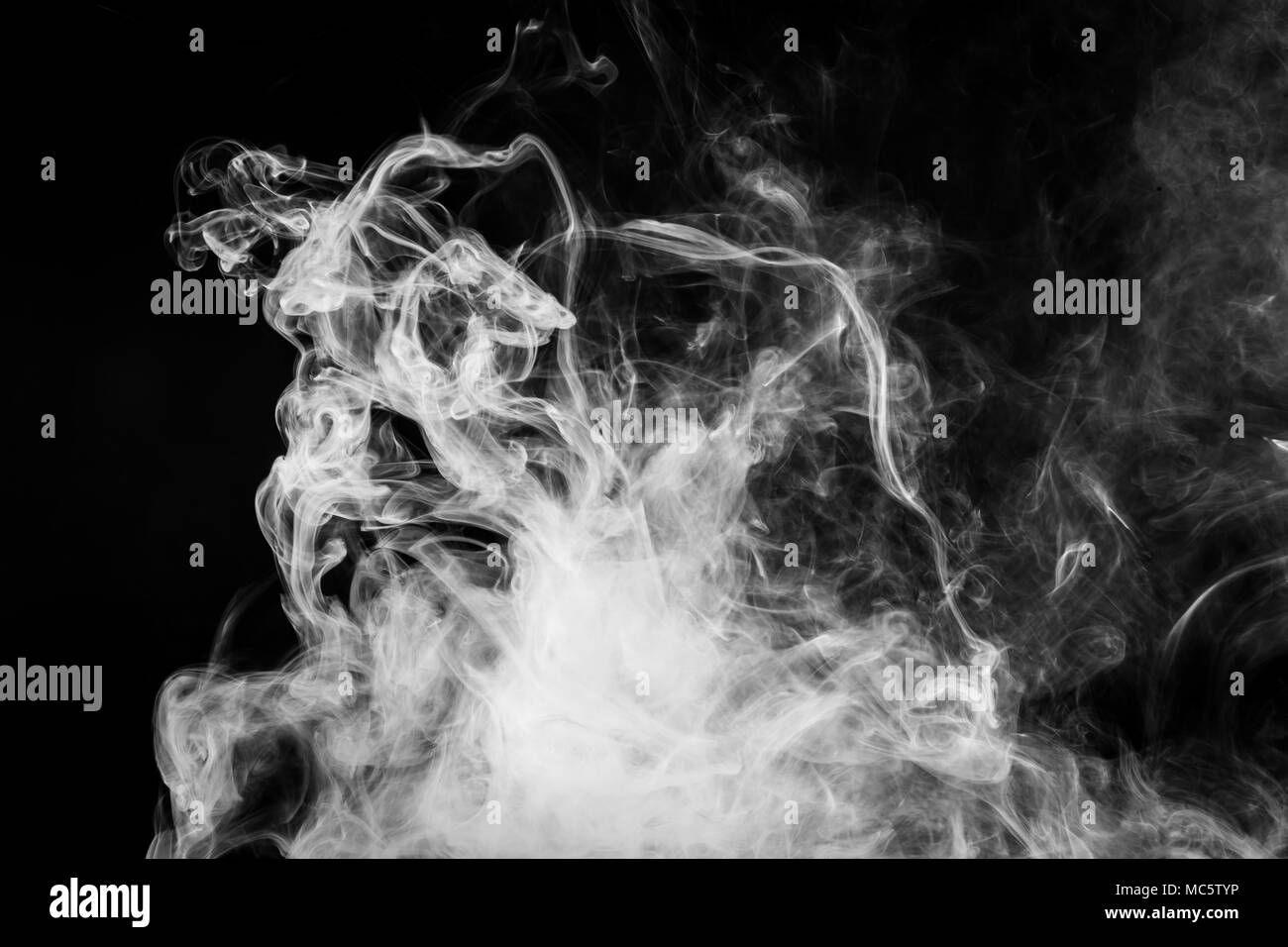 White cloud smoke on black isolated background Stock Photo - Alamy
