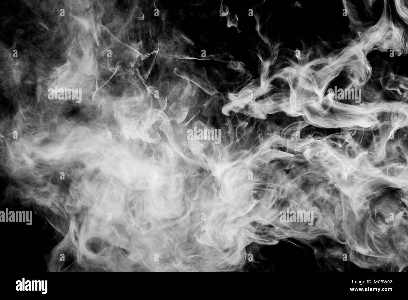 White cloud smoke on black isolated background Stock Photo - Alamy