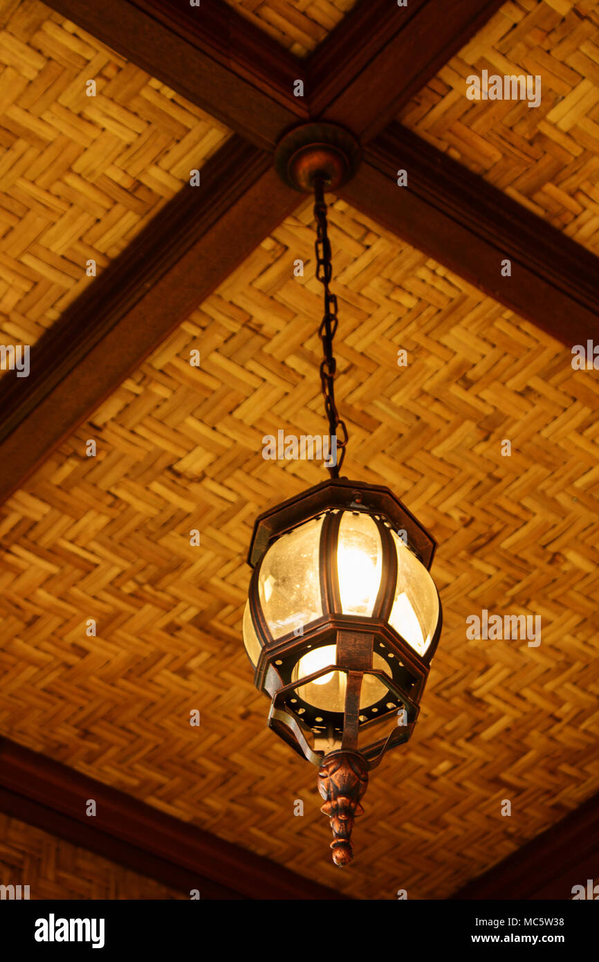 Classic Hanging Lamp On Bamboo And Wood Ceiling Stock Photo