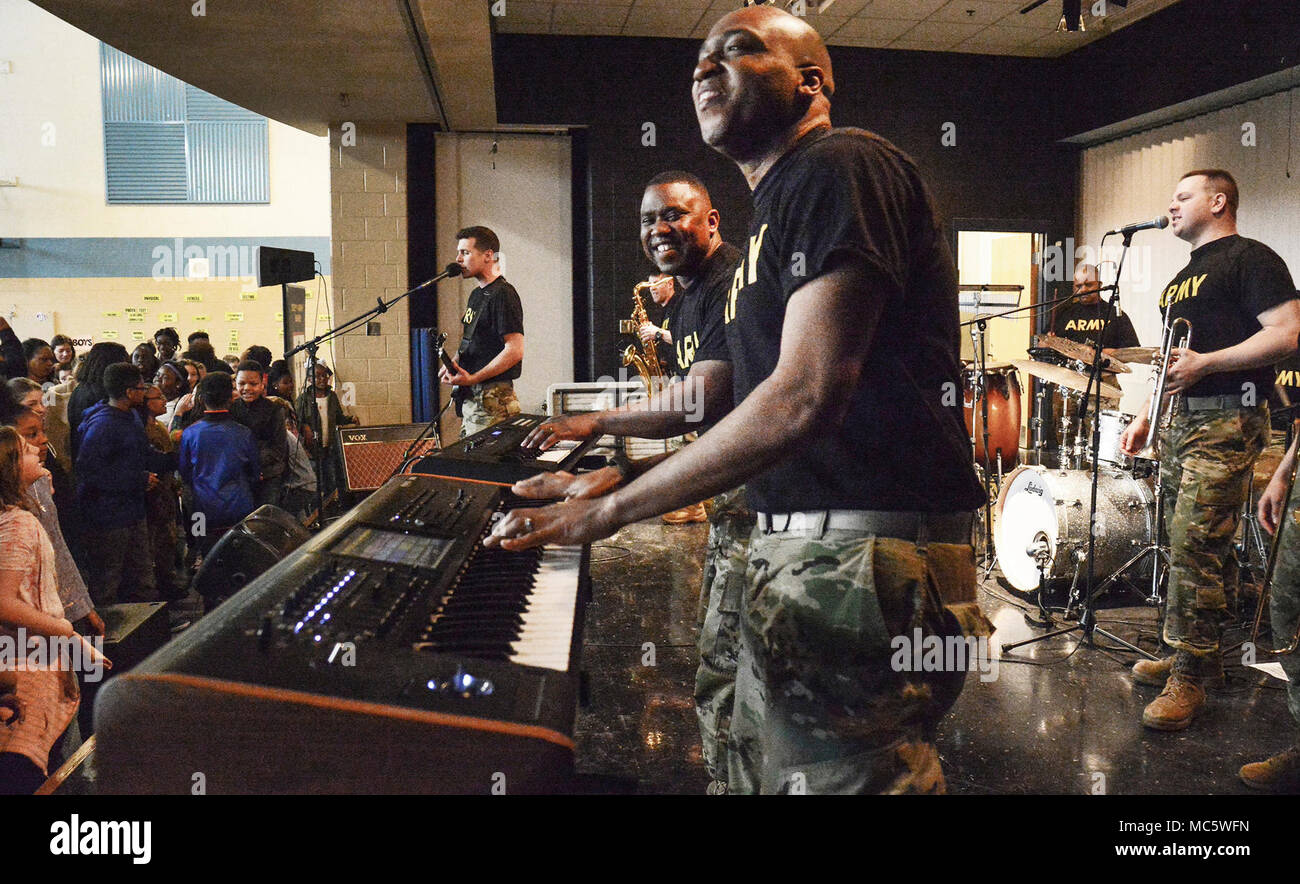 Sgt. David Dormeus and Spc Benjamin Hall perform with the 392nd Army Band rock ensemble during a