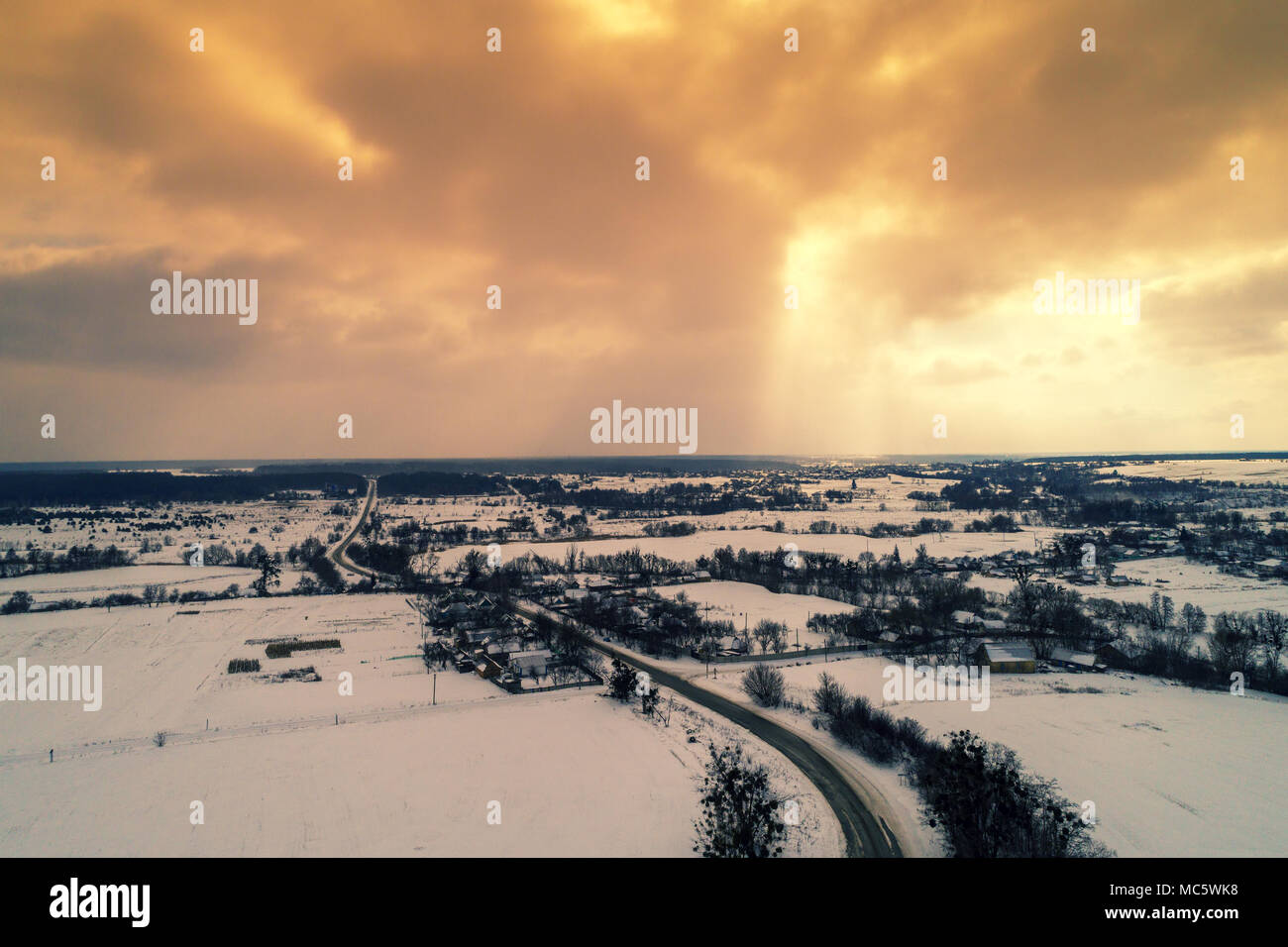 Aerial evening view at countryside and snowy fields during sunset Stock ...