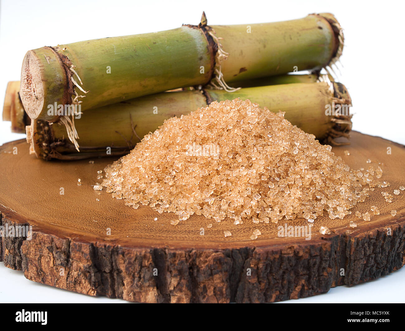 Sugar and Sugarcane ,Foods that are sweet , Placed on a wooden floor