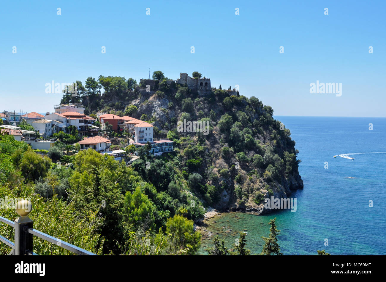 Parga, Epirus -Greece. Parga lies on the Ionian coast. It's a coastal resort town known for its natural environment. Castle of Parga ontop of the hill Stock Photo