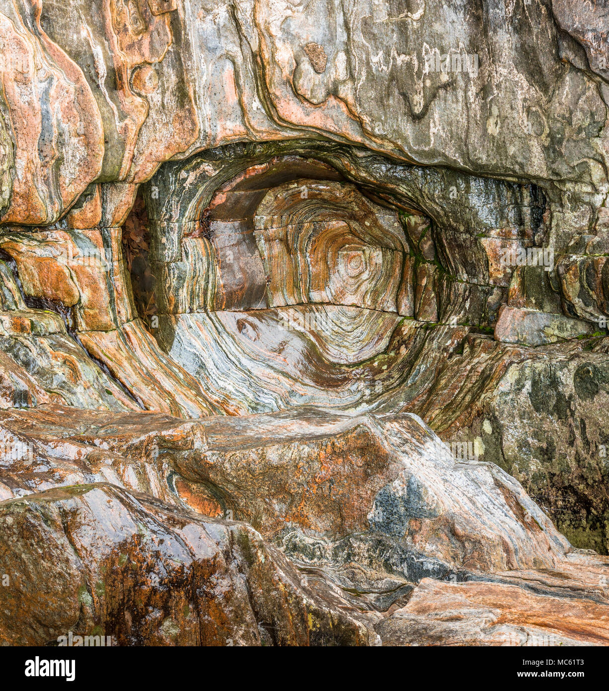 interesting colorful rock funnel up close and in detail in a gneiss ...