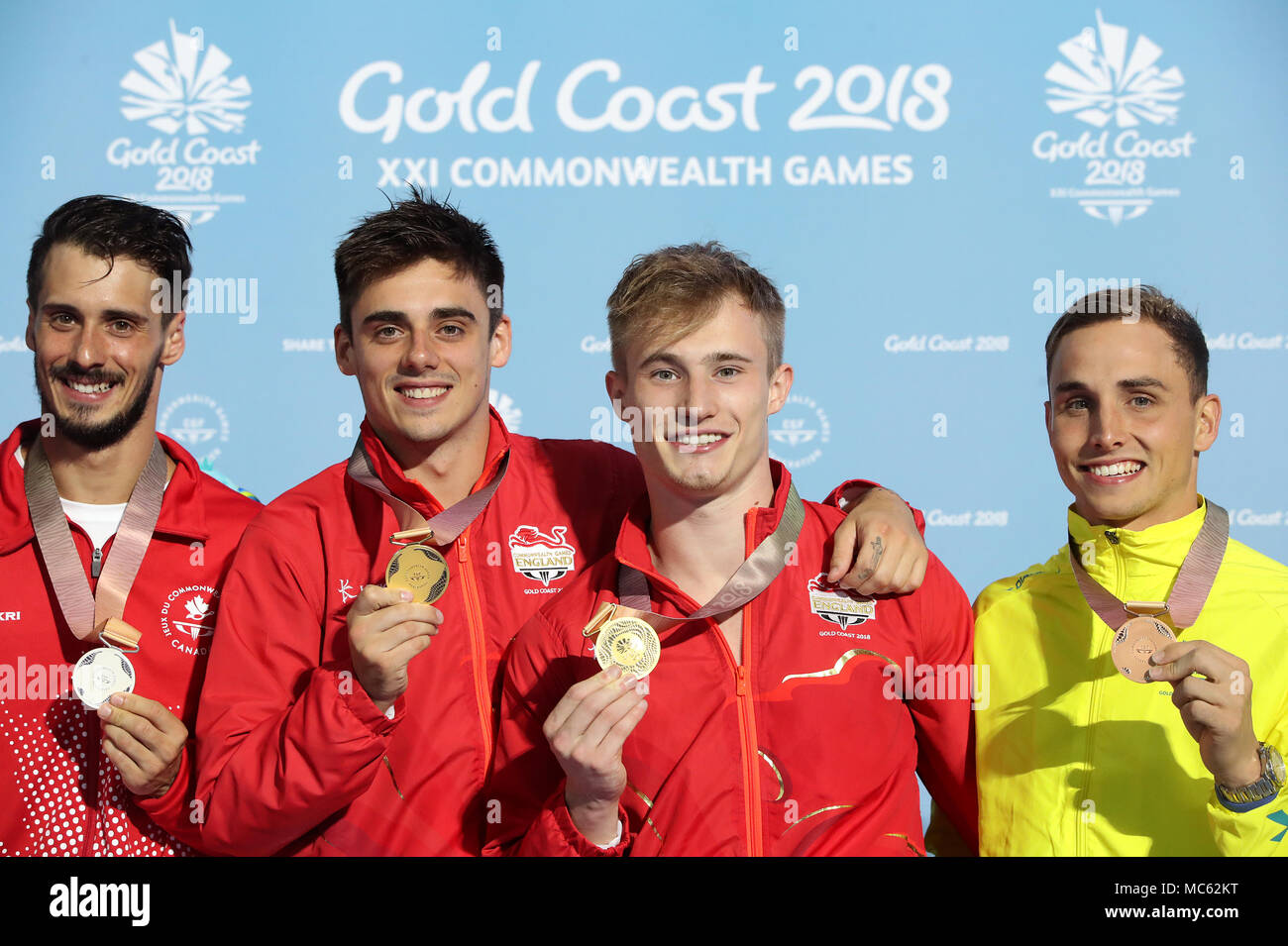 England's England's Jack Laugher (left centre) and Chris Mears celebrate with their gold medals on the podium, with silver medalists Canada's Francois Imbeau-Dulac (left) and Australia's Domonic Bedggood after the Men's Synchronised 3m Springboard at the Optus Aquatic Centre during day nine of the 2018 Commonwealth Games in the Gold Coast, Australia. Stock Photo